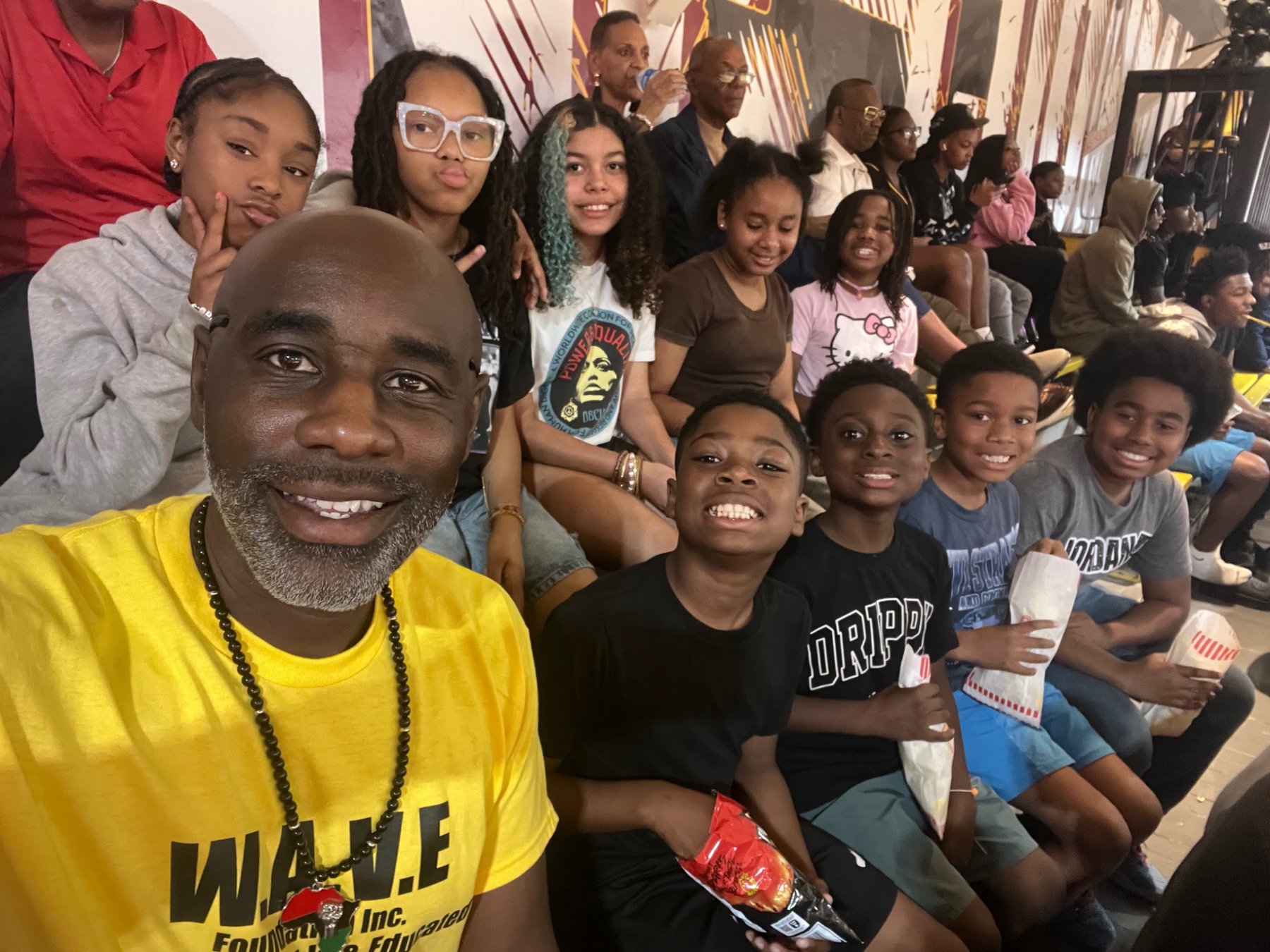 W.A.V.E. youth and an adult leader together at a group outing