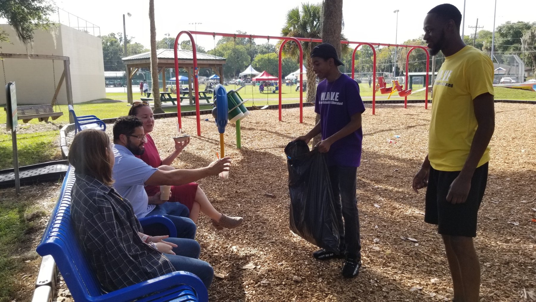 W.A.V.E. volunteers helping clean a community park
