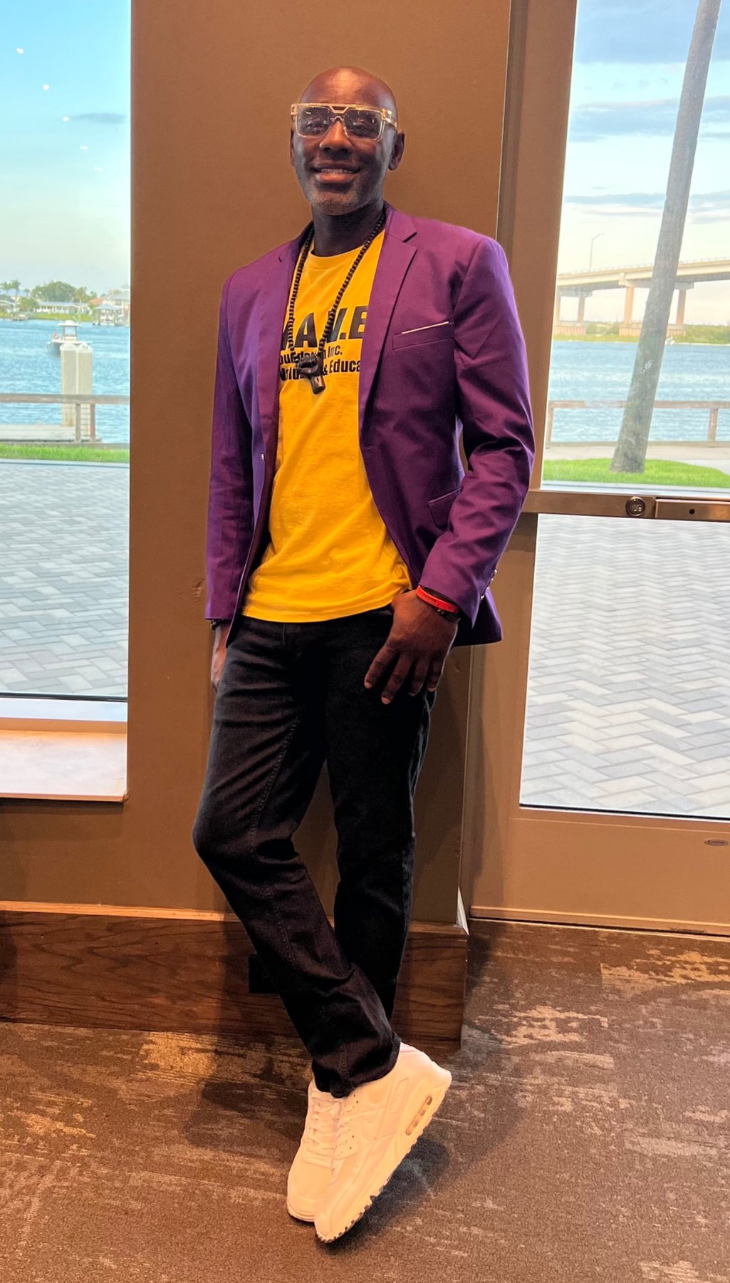 W.A.V.E. leadership wearing the organization's purple and gold colors